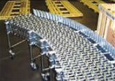 Curve Guards help guide packages under accumulation circumstances when packages of varying sizes and shapes begin to build up causing a potential risk of packages being pushed off the conveyor around the curve.